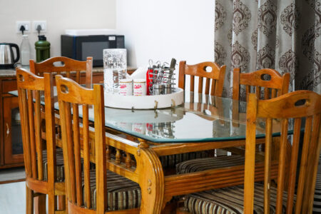 Close tabletop of dining table sitting in dining area of the house