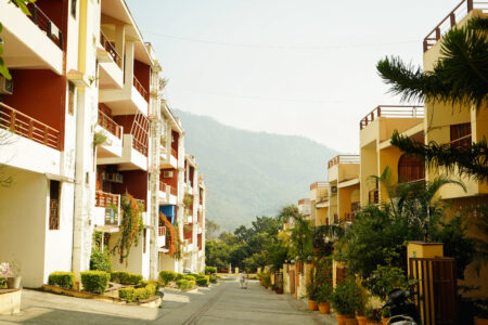 Quiet residential street inside the society with hills in background