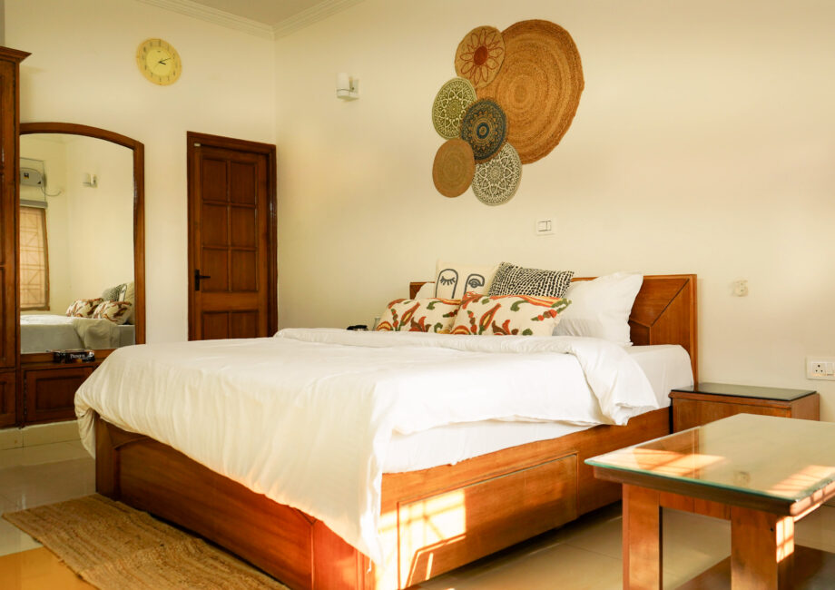 Bohemian suite king bed with jute wall art, layered textiles, and sunlight
