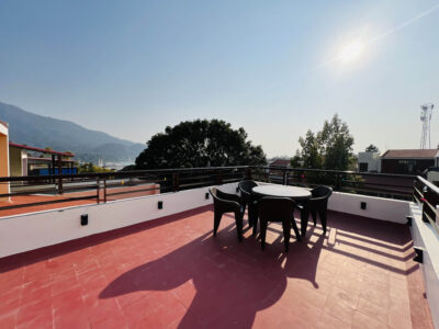 Shared terrace with outdoor seating, surrounded by fresh mountain air and clear sky views.