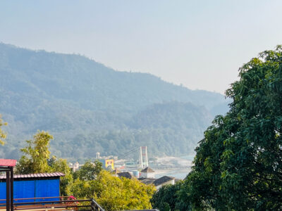 Mountain range view with glimpses of Rishikesh town and river from the terrace.